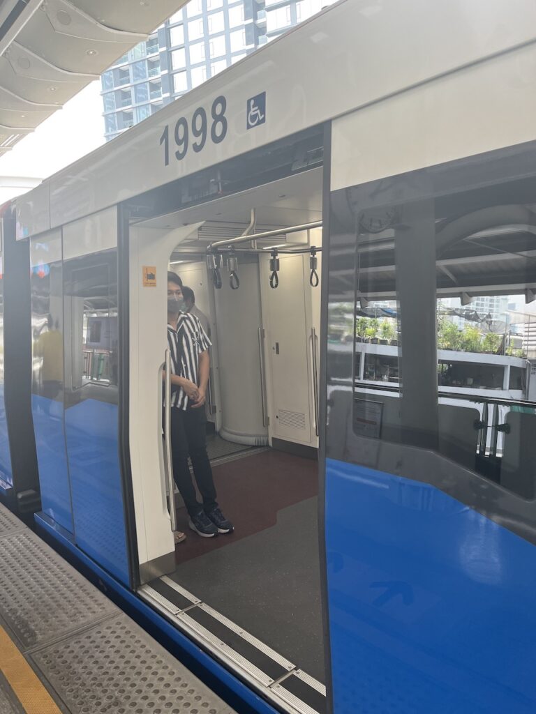 BTS Skytrain boarding in central Bangkok, Thailand