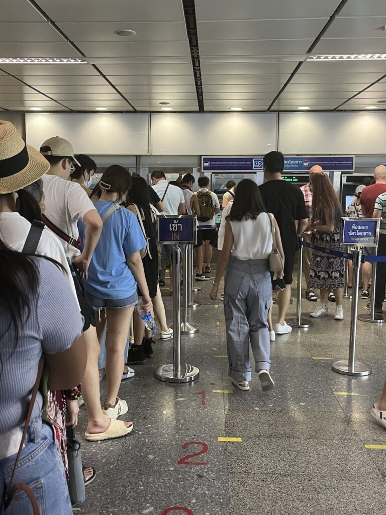 Commuters waiting to buy subway tokens at Sukhumvit MRT station in central Bangkok, Thailand.