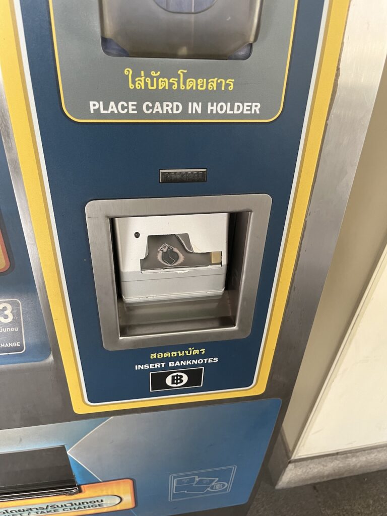 Bill collector on ticket vending machine for BTS Skytrain in Bangkok, Thailand