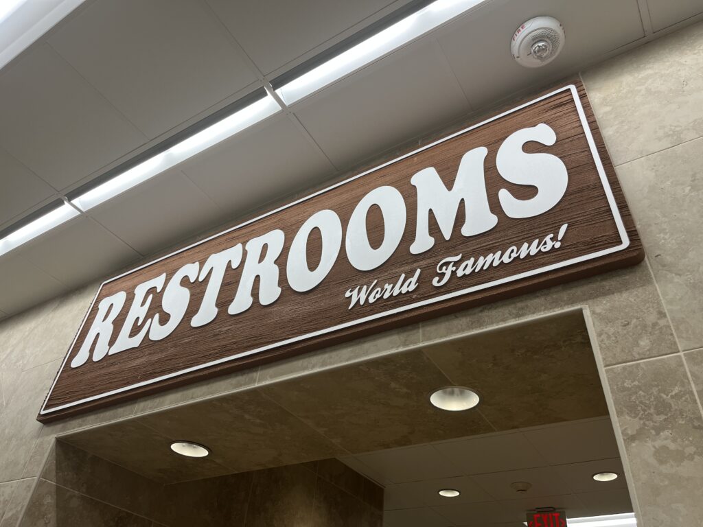 'restrooms' sign in a buc-ee's store