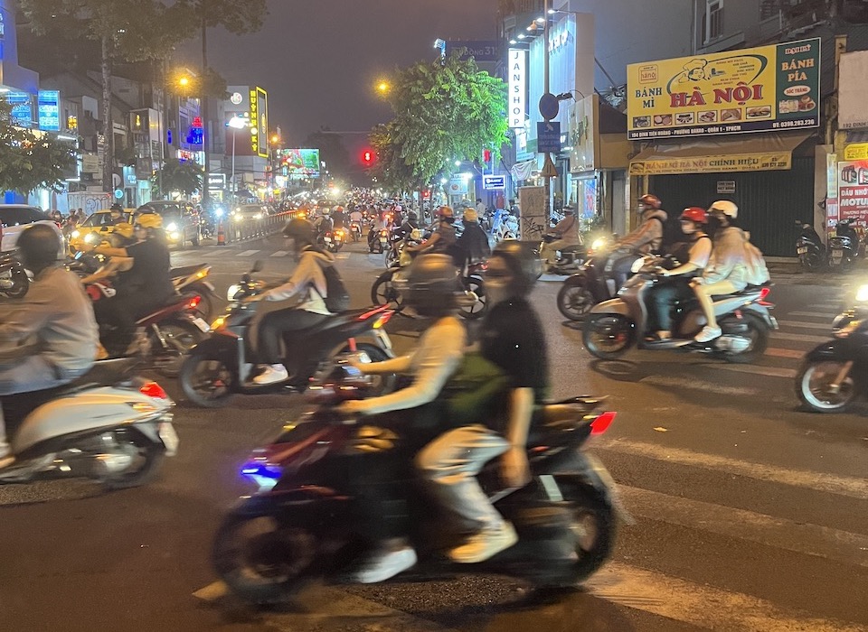 Motorbikes in Saigon in a crosswalk